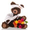 Bear with pain and flowers isolated over white background Royalty Free Stock Photo