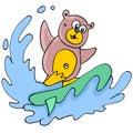 The bear is playing water surfing on the sea waves Royalty Free Stock Photo