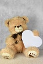 Bear Teddy with a heart loves you Royalty Free Stock Photo