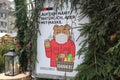 Bear-wearing-mask sign at Christmas market gate