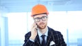 Beard Architectural Engineer Talking on Phone, Attending Call at Work