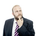 Beard business man is thinking and unsure Royalty Free Stock Photo
