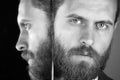 Face of serious bearded hipster man, businessman reflecting in mirror