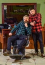 Beard grooming. Barbershop services. Perfect look. Facial hair. Handsome hipster. Person sitting in hydraulic chair