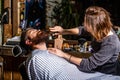 Beard man in barbershop. Hairstylist serving client at barber shop, bearded. Hairdresser, hair salon. Bearded man Royalty Free Stock Photo