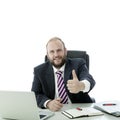 Beard man thumb up at desk Royalty Free Stock Photo