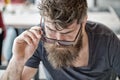 Beard masculinity attribute. Man bearded hipster hold sunglasses urban background. Macho with beard and mustache strict Royalty Free Stock Photo