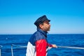 Beard sailor cap man sailing sea ocean in a boat Royalty Free Stock Photo