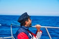 Beard sailor cap man sailing sea ocean in a boat Royalty Free Stock Photo