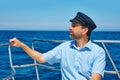 Beard sailor cap man sailing sea ocean in a boat Royalty Free Stock Photo