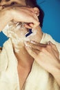 Beard shaving of macho with razor and cream Royalty Free Stock Photo