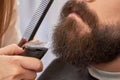 Beard trimming close up. Royalty Free Stock Photo