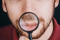 Beard under a magnifying glass. hairline on a man`s face close up. portrait of a guy with a mustache