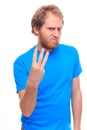 Bearded angry man showing three fingers Royalty Free Stock Photo
