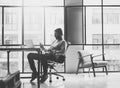 Bearded architect working on modern loft office. Texting message smartphone. Generic design notebook wood table