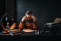 Bearded author in glasses reading his work Royalty Free Stock Photo