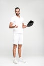 bearded baseball player with baseball mitt and ball,