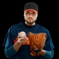 Bearded baseball player on black