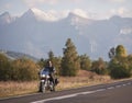 Bearded biker in black leather jacket on modern motorcycle on country roadside. Royalty Free Stock Photo