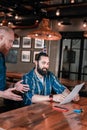 Bearded birthday man choosing some drinks for his guests