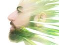 A bearded bold man profile double exposure portrait close up combined with a photo green tropical foliage