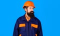 Bearded builder or architect in uniform and safety helmet. Construction worker in hard hat. Royalty Free Stock Photo