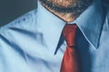 Bearded businessman in blue shirt and red necktie Royalty Free Stock Photo