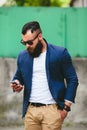 Bearded businessman looking at phone Royalty Free Stock Photo