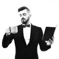 Bearded businessman or speaker with concentrated look, planner and cup