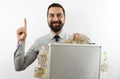 Bearded businessman on white background smiling with raised arm and pointing finger up holding up with his hand a briefcase full o Royalty Free Stock Photo