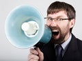 Bearded businessman yelling through bullhorn. Public Relations. man expresses various emotions. photos of young Royalty Free Stock Photo
