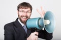 Bearded businessman yelling through bullhorn. Public Relations. man expresses various emotions. photos of young Royalty Free Stock Photo