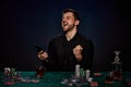 Bearded casino player man playing poker on green table Royalty Free Stock Photo