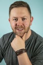 Bearded casual man looking pensively at the camera