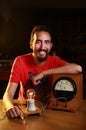 Bearded Caucasian electric man posing with a vintage voltmeter and a light bulb Royalty Free Stock Photo