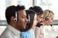 Bearded caucasian man working in call center amoung colleagues. Royalty Free Stock Photo
