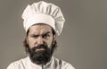 Bearded chef, cooks or baker. Bearded male chefs . Confident bearded male chef in white uniform. Serious cook in