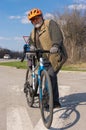 Bearded, chubby senior man getting ready to ride on gravel bicycle