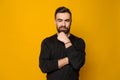 Bearded confident man posing in black sweater