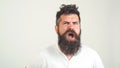 Bearded crazy man confused face. Angry man with beard with emotion, on white background. Emotion, face expression cocncept. Brutal
