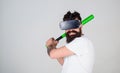 Bearded gamer with agitated look training batting skills, simulation game concept. Man with stylish beard posing with Royalty Free Stock Photo