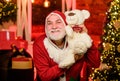 Bearded grandfather senior man celebrate christmas. Kind grandpa with teddy bear. Christmas decoration. Charity and