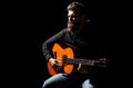 Bearded guitarist plays. Play the guitar. Beard hipster man sitting in a pub. Live music. Guitars and strings. Bearded Royalty Free Stock Photo