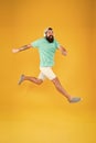 Bearded guy enjoy music. Impetuous movement. Hipster dancing jumping headphones gadget. Inspiring song. Music library