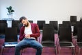 Bearded guy sitting and sleeping in conference room Royalty Free Stock Photo