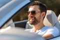 Bearded guy wearing sunglasses driving cabriolet Royalty Free Stock Photo