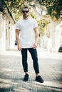 Bearded guy wearing white blank t-shirt and blue Royalty Free Stock Photo