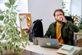 Bearded guy work on laptop in office drinking coffee, alone, success and business