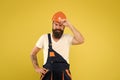 Bearded guy worker on yellow background. Home Design and Renovation Trends. Engineer builder uniform. Man builder hard Royalty Free Stock Photo