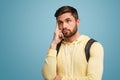 Thoughtful young student looking up Royalty Free Stock Photo